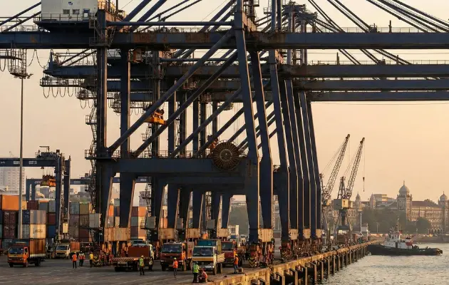 Container terminal operations with cranes handling cargo at port