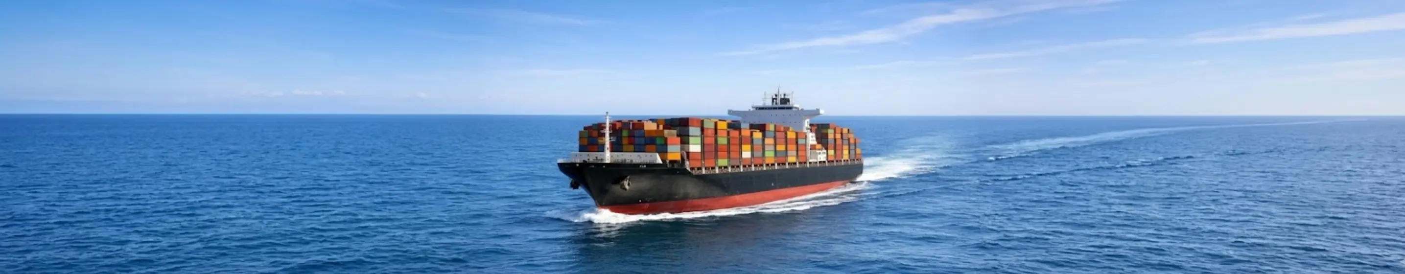 Container ship sailing across the ocean for international sea freight