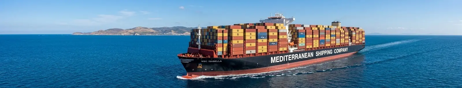 Container ship sailing across the ocean for international sea freight